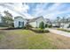 Attractive one-story home with a well-kept lawn, established plantings, and a paved driveway at 106 Willet Dr, Summerville, SC 29485