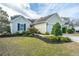 Inviting single-story home featuring a landscaped front yard, attached garage, and classic curb appeal at 106 Willet Dr, Summerville, SC 29485