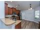 Well-lit kitchen features wood cabinets, stainless steel appliances, and a breakfast bar at 106 Willet Dr, Summerville, SC 29485