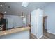 Open-concept kitchen features wood cabinets, a breakfast bar, a skylight, and stainless steel appliances at 106 Willet Dr, Summerville, SC 29485