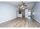 Spacious living area with wood floors, ceiling fan, and an open layout connecting to the kitchen at 106 Willet Dr, Summerville, SC 29485