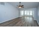 Inviting living room with wood flooring, ceiling fan, lots of natural light, and a comfortable ambiance at 106 Willet Dr, Summerville, SC 29485