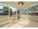 Relaxing screened porch with tile floors, a ceiling fan, and serene backyard views at 106 Willet Dr, Summerville, SC 29485