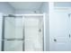 Bright shower with a clear glass door, white tiled walls, and sleek fixtures at 106 Willet Dr, Summerville, SC 29485
