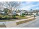 View of the home in the neighborhood with sidewalks and well-maintained lawns and landscaping at 106 Willet Dr, Summerville, SC 29485