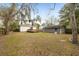 Expansive backyard featuring a wooden deck, shed, and mature trees providing shade at 1195 Marquis Rd, North Charleston, SC 29405