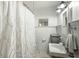 Cozy bathroom featuring white wainscoting, patterned shower curtain, and vintage style sink at 1195 Marquis Rd, North Charleston, SC 29405