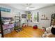 Whimsical bedroom with hardwood floors, Snoopy decor, and natural light at 1195 Marquis Rd, North Charleston, SC 29405