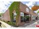 Attractive commercial building with brick, ivy, and outdoor seating at 1195 Marquis Rd, North Charleston, SC 29405