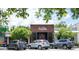 Charming exterior with brick, signage, and cars parked in front at 1195 Marquis Rd, North Charleston, SC 29405