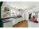 Clean kitchen with white cabinets, tile floors, and plenty of natural light from the window at 1195 Marquis Rd, North Charleston, SC 29405