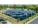 Large, modern playground with shade covers, activity stations, and surrounded by lush green space and a parking lot at 1195 Marquis Rd, North Charleston, SC 29405