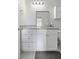 Bathroom with granite countertop vanity with white cabinets, drawers, mirror and towel holder at 130 River Landing Dr # 7309, Charleston, SC 29492