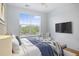 Stylized bedroom with a large window, ceiling fan, television and a decorative headboard at 130 River Landing Dr # 7309, Charleston, SC 29492