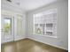 Well-lit room with a large windows and hardwood floors at 130 River Landing Dr # 7309, Charleston, SC 29492