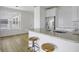 Kitchen area features a granite countertop with barstool seating and modern stainless steel appliances at 130 River Landing Dr # 7309, Charleston, SC 29492