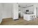 Bright kitchen with stainless steel appliances, white cabinetry, and center island with bar stool seating at 130 River Landing Dr # 7309, Charleston, SC 29492