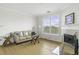 Bright living room features a fireplace, hardwood floors, and comfortable seating at 130 River Landing Dr # 7309, Charleston, SC 29492