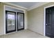 Covered patio with glass doors to the interior and an additional door to the exterior at 130 River Landing Dr # 7309, Charleston, SC 29492