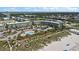 Beautiful aerial view of the beachfront condos with a pool, palm trees, and direct beach access at 1300 Ocean Blvd # 102 A, Isle of Palms, SC 29451