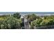 Picturesque beach access over private pier surrounded by lush greenery, offering a serene path to the sandy shores at 1300 Ocean Blvd # 102 A, Isle of Palms, SC 29451