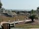 Beach access with boardwalk leading to the ocean, surrounded by lush landscaping and palm trees at 1300 Ocean Blvd # 102 A, Isle of Palms, SC 29451