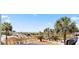 Beach access featuring palm trees and a boardwalk, on a sunny day at 1300 Ocean Blvd # 102 A, Isle of Palms, SC 29451