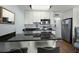 Modern kitchen featuring granite countertops, stainless steel appliances and white cabinetry at 1300 Ocean Blvd # 102 A, Isle of Palms, SC 29451