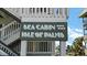 The signage indicates the building's name, Sea Cabin Isle of Palms, offering a sense of place and community at 1300 Ocean Blvd # 102 A, Isle of Palms, SC 29451