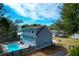 Aerial view of the backyard including the pool, patio area, and surrounding greenery at 1328 Erckmann Dr, Mount Pleasant, SC 29464