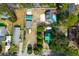 Aerial view of a property showcasing the home, outbuildings, pool, and surrounding landscape at 1328 Erckmann Dr, Mount Pleasant, SC 29464