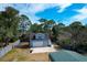 Overhead view of the property featuring a garage and RV parking, surrounded by trees at 1328 Erckmann Dr, Mount Pleasant, SC 29464