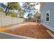 Large fenced backyard with a combination of concrete and natural ground cover at 1328 Erckmann Dr, Mount Pleasant, SC 29464