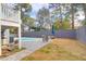 View of the backyard featuring a swimming pool, chairs, and a well-maintained lawn at 1328 Erckmann Dr, Mount Pleasant, SC 29464