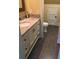 Bathroom with granite countertop, white cabinets, and tile floors. There is a toilet in a separate area at 1328 Erckmann Dr, Mount Pleasant, SC 29464