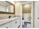 Bright bathroom features a granite countertop, wood-framed mirror, and access to a storage room at 1328 Erckmann Dr, Mount Pleasant, SC 29464
