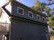 The back of the carriage house showing windows on the upper level and steps leading to a balcony at 1328 Erckmann Dr, Mount Pleasant, SC 29464