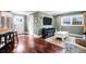 Spacious living room connecting to the kitchen, featuring wood floors and neutral decor at 1328 Erckmann Dr, Mount Pleasant, SC 29464