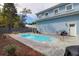 In-ground pool with brick border, patio furniture, grill, and direct access to the house at 1328 Erckmann Dr, Mount Pleasant, SC 29464