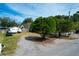 Expansive lot with mature trees, a white-painted house, and a trailer in the back at 1328 Erckmann Dr, Mount Pleasant, SC 29464