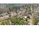 Wide aerial view of a residential area with many homes surrounded by mature trees and well-kept lawns at 144 Cinnamon Rd, Summerville, SC 29483