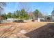 Expansive backyard featuring a shed and bordered by a wooden fence, offering plenty of outdoor space at 144 Cinnamon Rd, Summerville, SC 29483