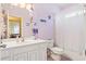 Bathroom with white vanity, neutral colored walls, toilet, and shower-tub combo at 144 Cinnamon Rd, Summerville, SC 29483