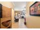Inviting hallway leading to a living room featuring hardwood floors, a fireplace, and ample natural light at 144 Cinnamon Rd, Summerville, SC 29483