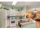Traditional-style kitchen features neutral-colored cabinets, modern appliances, and an open-concept layout at 144 Cinnamon Rd, Summerville, SC 29483