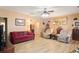Comfortable living room featuring hardwood floors, ample seating, and natural lighting at 144 Cinnamon Rd, Summerville, SC 29483