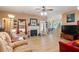 Bright living room featuring a fireplace, comfortable seating, hardwood floors and open access to the dining room at 144 Cinnamon Rd, Summerville, SC 29483