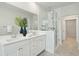 Elegant bathroom featuring a double vanity, glass shower enclosure, and soft, modern decor at 1515 Hidalgo Dr, Mount Pleasant, SC 29464