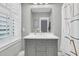 Bathroom featuring a gray vanity with white countertop, mirror, and a shower curtain at 1556 Cranes Nest Rd, Mount Pleasant, SC 29466