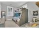 Bedroom with a gray bunk bed with storage, a desk, and a comfortable chair at 1556 Cranes Nest Rd, Mount Pleasant, SC 29466